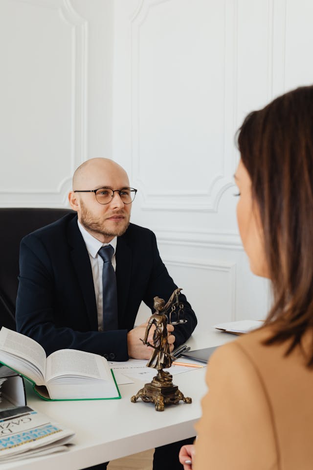 A Lawyer Talking to Clients