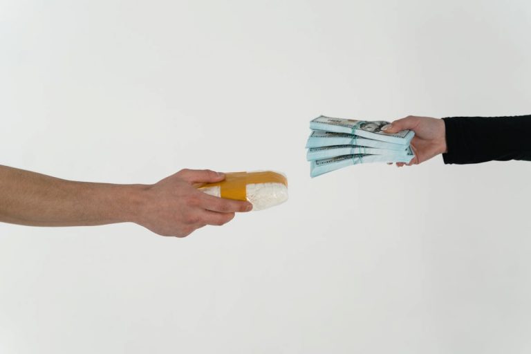 Person Holding Yellow and Blue Ice Cream