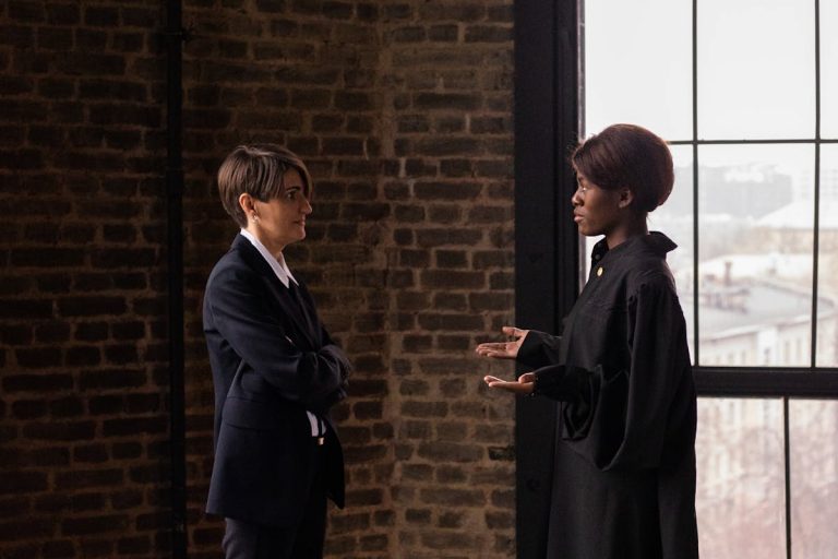 A Woman in a Suit Talking to a Judge