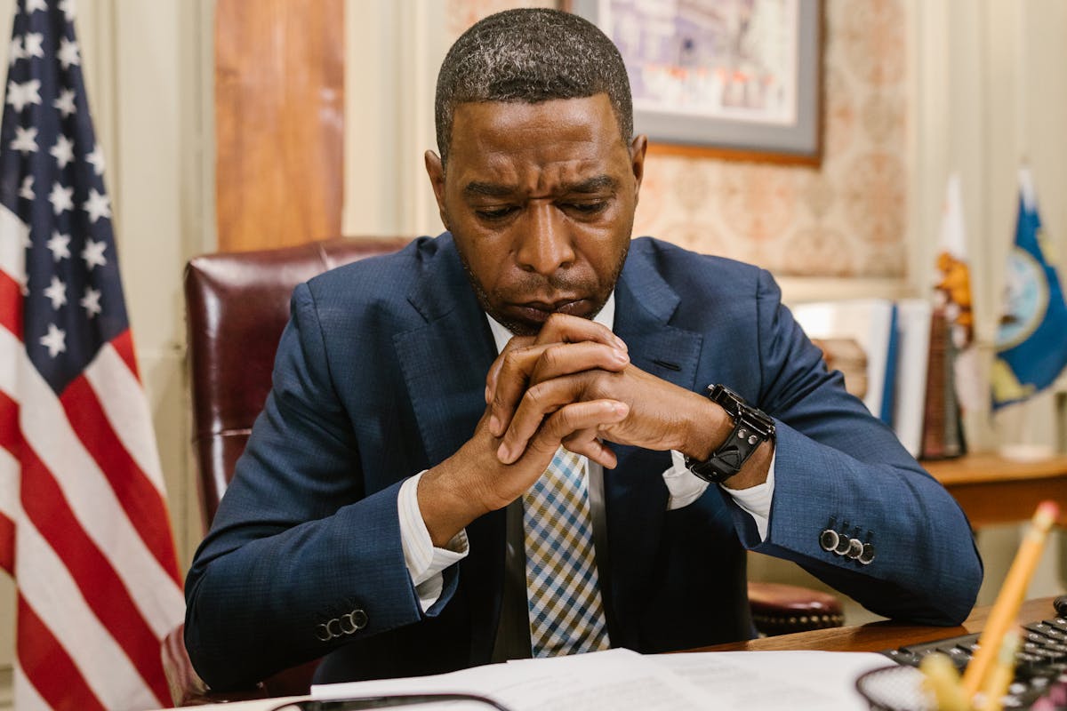 An Attorney in Blue Suit Looking at Documents
