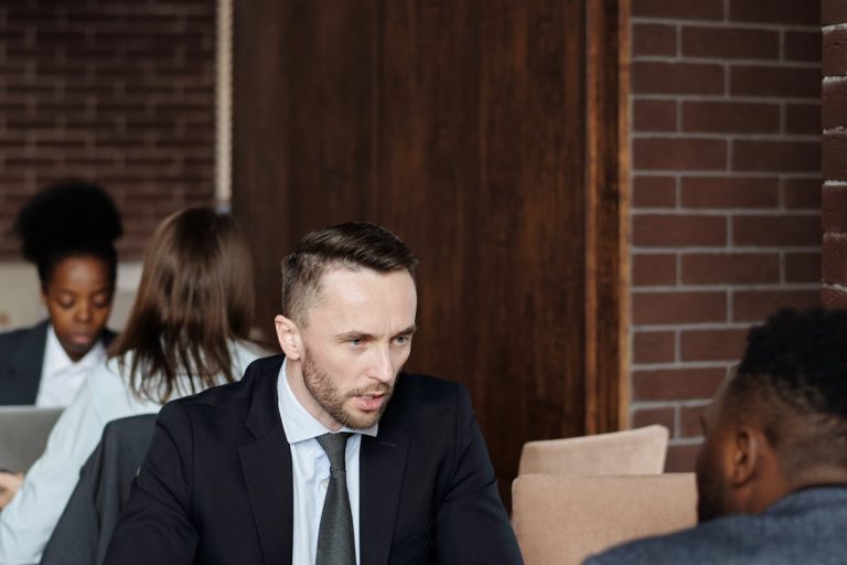 Businessmen Talking at a Cafe