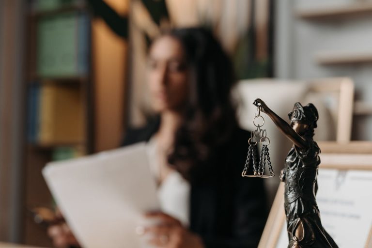 Figurine of Justice on Table in Office