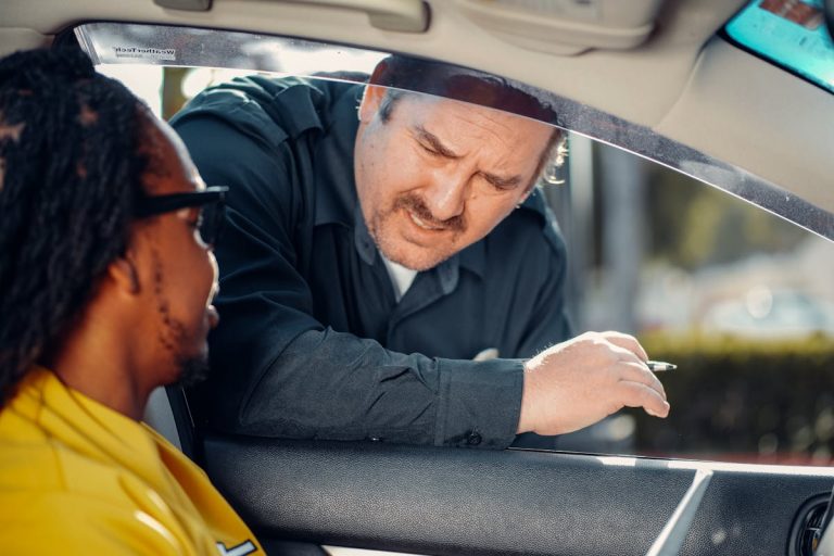 Man Talking to the Person Inside the Car