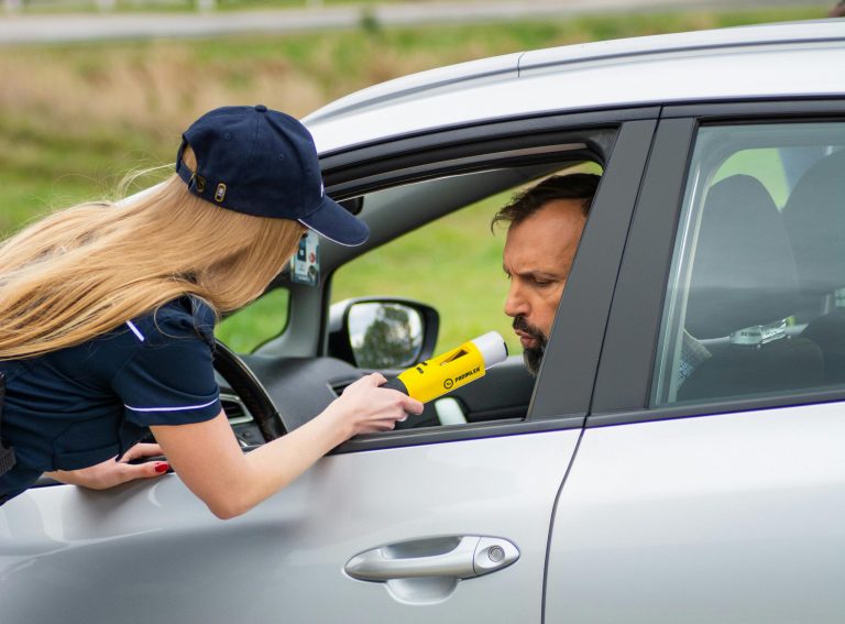 Police Officer Conducting DUI Check on Driver